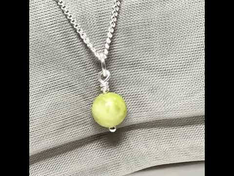 A small real green gypsum necklace ball shaped, a gorgeous round pendant with chain