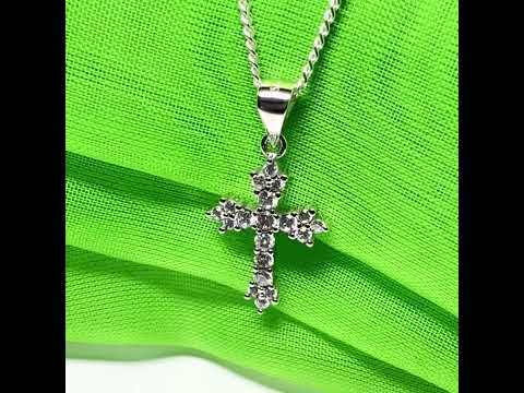 Fancy cubic zirconia set sterling silver cross with a chain