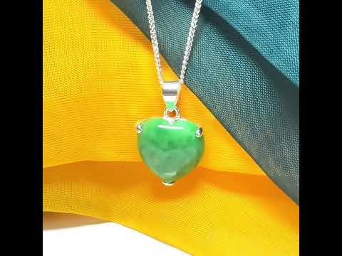 A really stunning real green jade necklace heart shaped sterling silver with a curb chain included as well