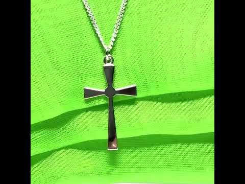 A thick solid sterling silver cross necklace fancy shaped pendant with a chain