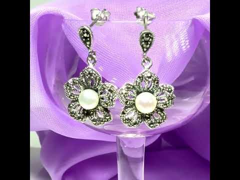 Video of a pair of earrings real marcasite and real freshwater cultured pearl flower shaped sterling silver