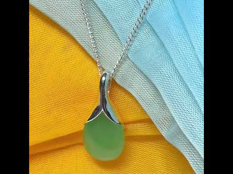 A really stunning real green jade necklace in a teardrop, a timeless designed pendant