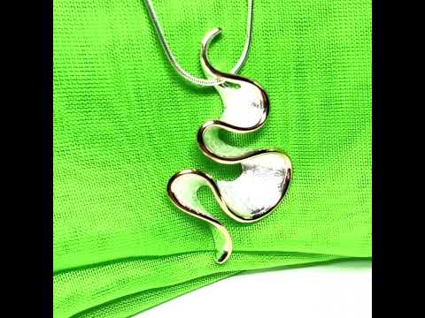 A sterling silver solid rounded open pierced fancy swirl necklace with snake chain