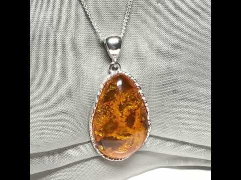 Video of a Large necklace real amber irregular shaped pendant sterling silver