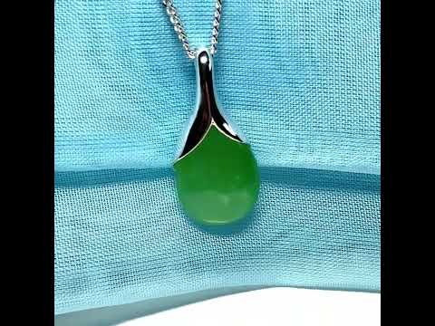 A real green jade pendant necklace in a distinctive teardrop shape or pear shaped designed with a chain