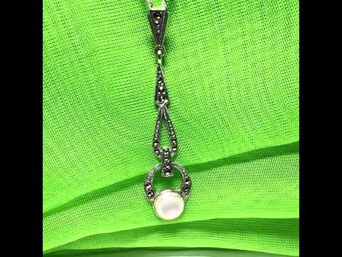 Video of a Long real Mother of Pearl and marcasite sterling silver necklace With chain