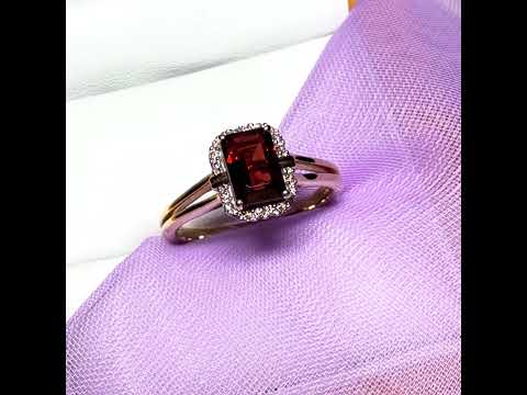 Video of a 1.25 Carat garnet and diamond yellow gold octagonal cluster ring