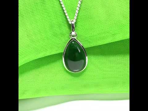 A real dark green jade necklace in a tear drop or pear shape smooth rub over setting with a chain