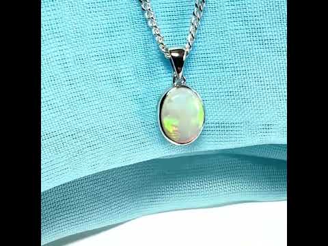 White gold real oval opal pendant rubbed over necklace with chain