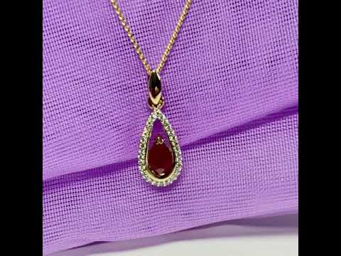 Real red pear shaped ruby and diamond pierced necklace yellow gold