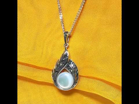 Video of a Real Mother of Pearl and marcasite sterling silver necklace round stone