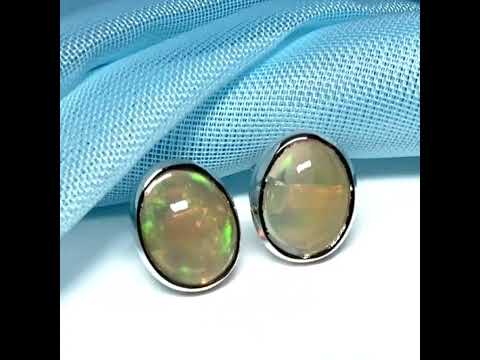 Video of a pair of real opal sterling silver oval shaped stud earrings