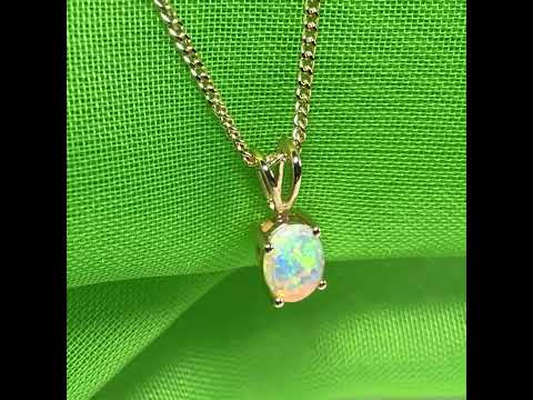 Real opal pendant oval cut yellow gold