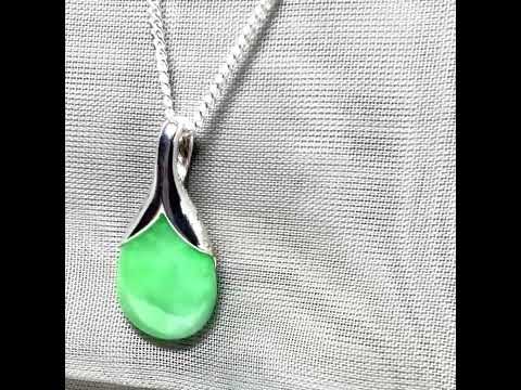 A real green jade necklace in a teardrop or pear shape, a gorgeous designed pendant