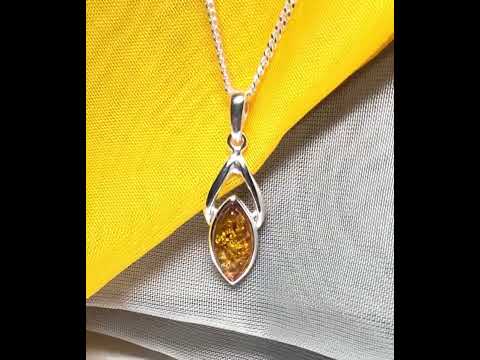 A real amber necklace sterling silver marquise shaped open pendant with chain