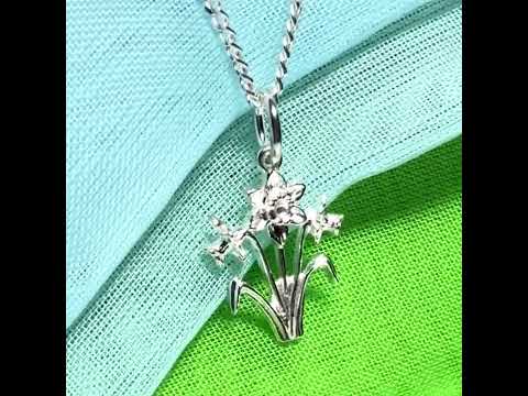 Including chain

Daffodil necklace

Solid

Sterling Silver

Gift box included

This beautiful sterling silver Welsh daffodil flower shaped necklace, that is a perfect addition to a silver jewellery collection.

On a solid sterling silver chain.

Daffodil flowers are often given to a Mum as a sign of love, a perfect Mother’s Day gift idea, or simply for no reason at all.

It is made up of three detailed daffodils on stems, and two leaves one either side.

The daffodil flower is the national flower of Wales