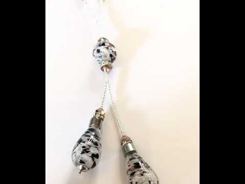 Video of a Beautiful black white and gold dropped beaded real Murano glass necklace