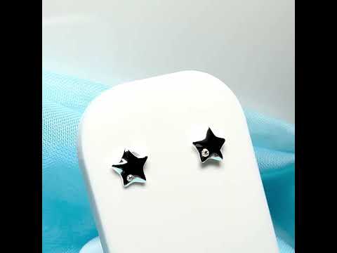 Video of a pair of Star stud earrings sterling silver with real diamond stones