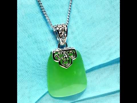 Real green jade necklace with a large shaped and patterned top pendant with chain