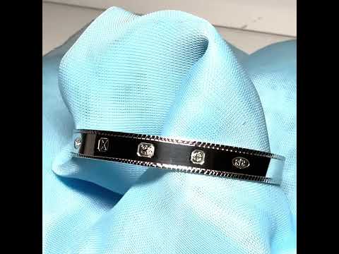 Video of a Childs medium expanding bangle sterling silver with a Hallmark feature design diamond cut edge