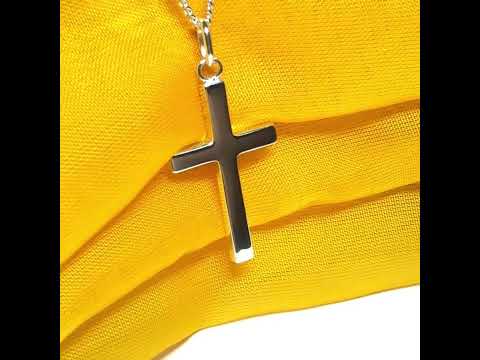 Cross and chain highly polished with an oval pendant loop on top of it chain included