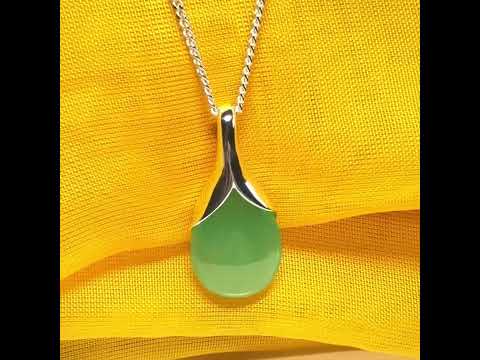 A real green jade necklace in a teardrop or pear shaped including a chain and a gift box included