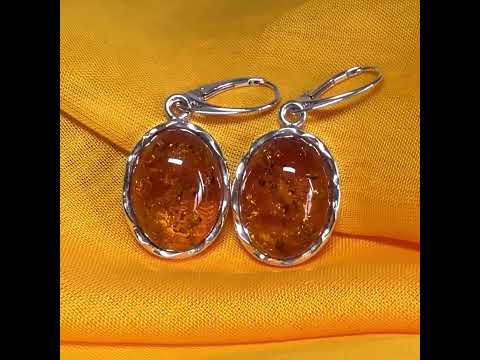 A pair of real amber drop earrings oval in shape sterling silver continental wire fittings