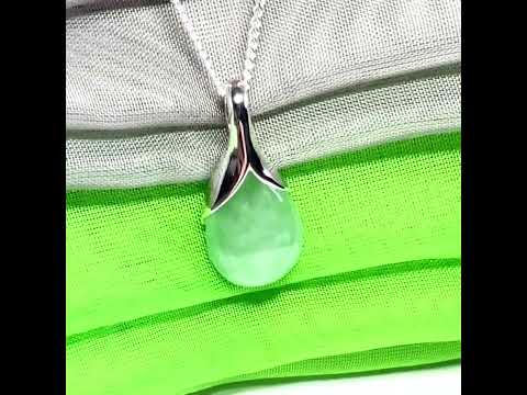 A beautiful real green jade necklace in a teardrop or pear shape, a gorgeous designed pendant