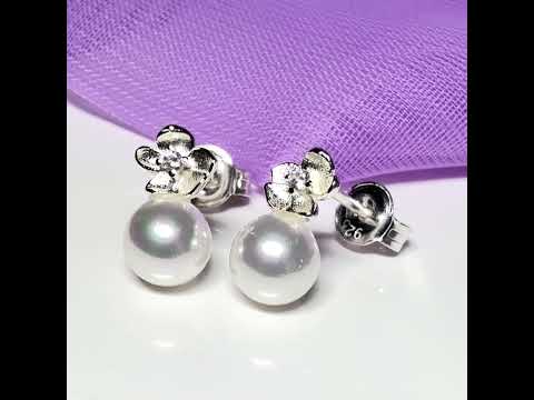 Video of a pair of real freshwater pearl sterling silver round shaped flower stud earrings