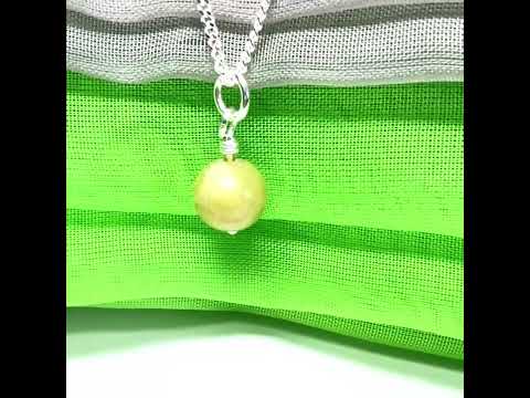 A small real green gypsum necklace ball shaped, a gorgeous pendant with chain