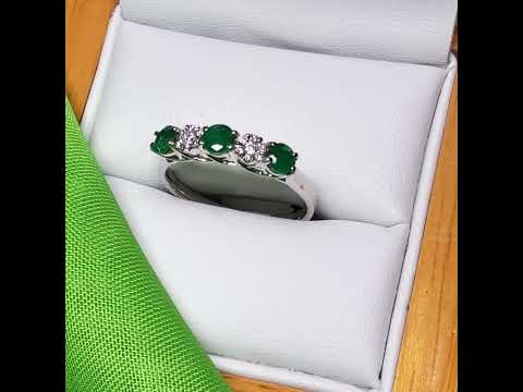 Video of a Real emerald and diamond white gold eternity ring claw setting