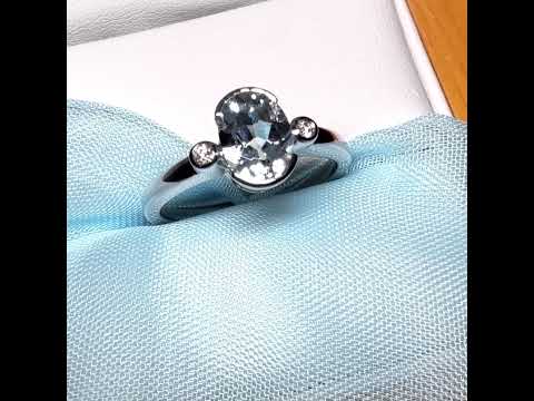 An oval real aquamarine ring and real round diamond white gold trilogy three stone dress, simply stunning
