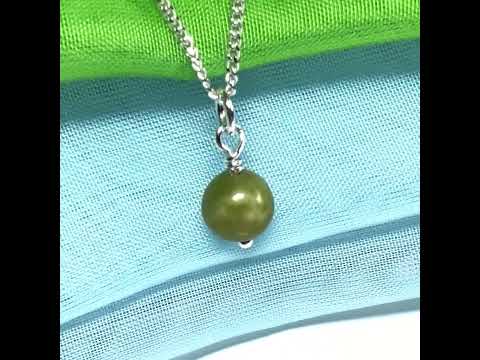 A small real green gypsum necklace ball shaped, a really gorgeous round pendant