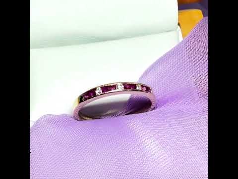 Video of a real red ruby and diamond channel set eternity ring yellow gold