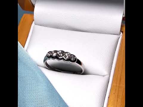 Video of a White gold round cut eternity ring diamond rubbed over setting 27 points
