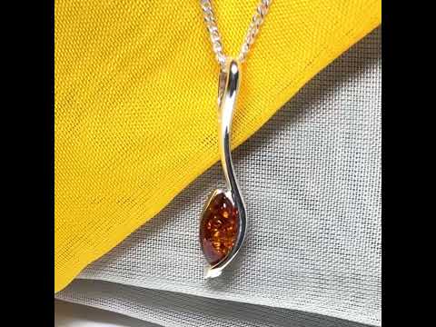 A Sterling silver real amber marquise shaped necklace swirled pendant