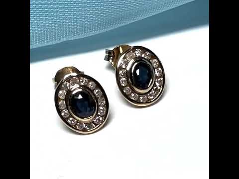 Blue real dark blue sapphire and diamond stud earrings yellow gold oval shaped cluster