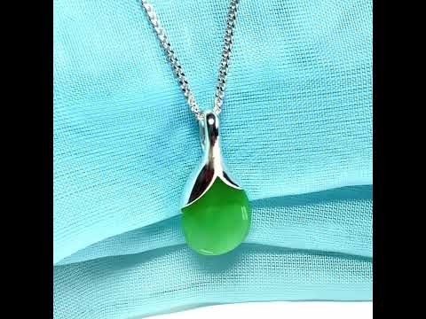A real green jade necklace in a tear drop or pear shaped with a chain