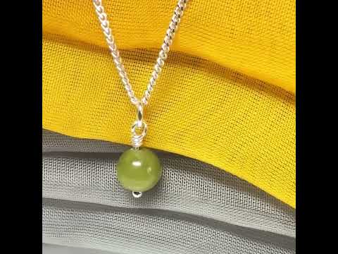 A really gorgeous small real green gypsum necklace ball shaped, a really gorgeous round pendant with chain