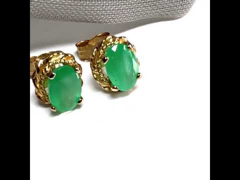 Real emerald pair of stud earrings oval shape with a rope edged design