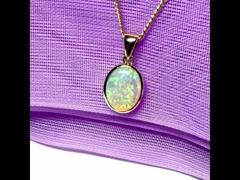 Real opal necklace yellow gold oval pendant smooth rubbed over setting