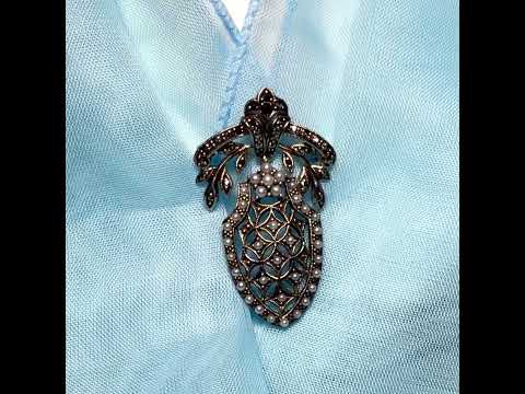 Video of a pearl shield shaped brooch real freshwater cultured sterling silver with marcasite stones