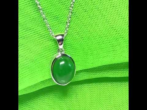 Real green jade necklace white gold oval rub over smooth setting with a chain