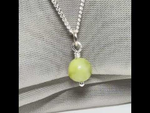 A small real green gypsum necklace ball shaped, a gorgeous round pendant