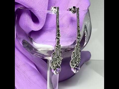 Video of a Long real purple amethyst and real marcasite fancy dropped earrings