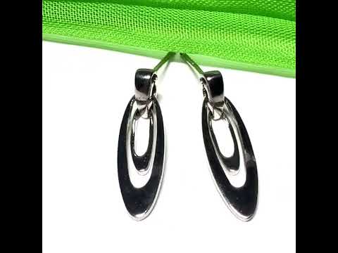 Video of a pair of oval shaped open drop earrings sterling silver