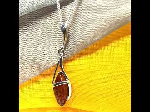 A Sterling silver real amber marquise shaped necklace swirled open pendant with chain