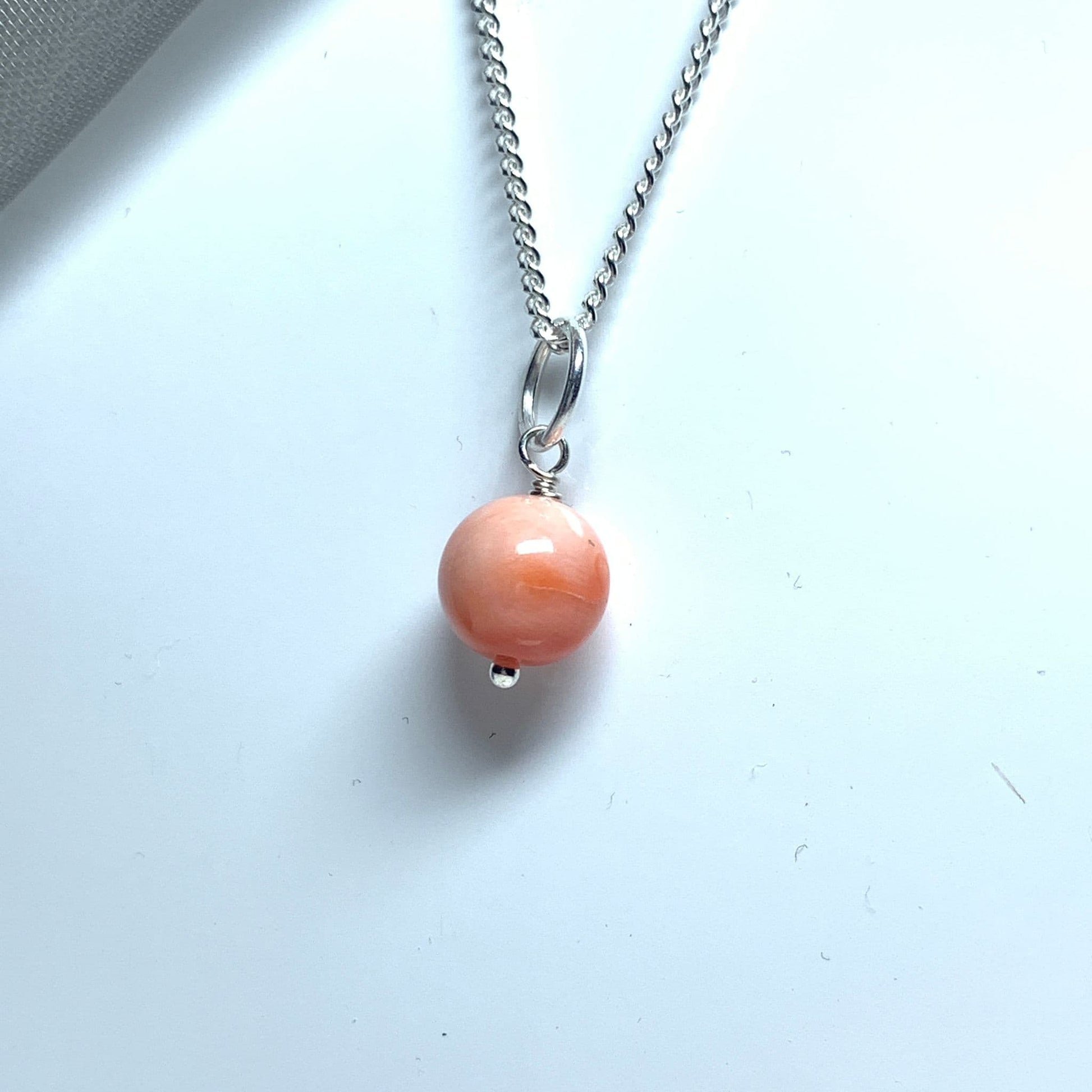 Round coral sterling silver necklace