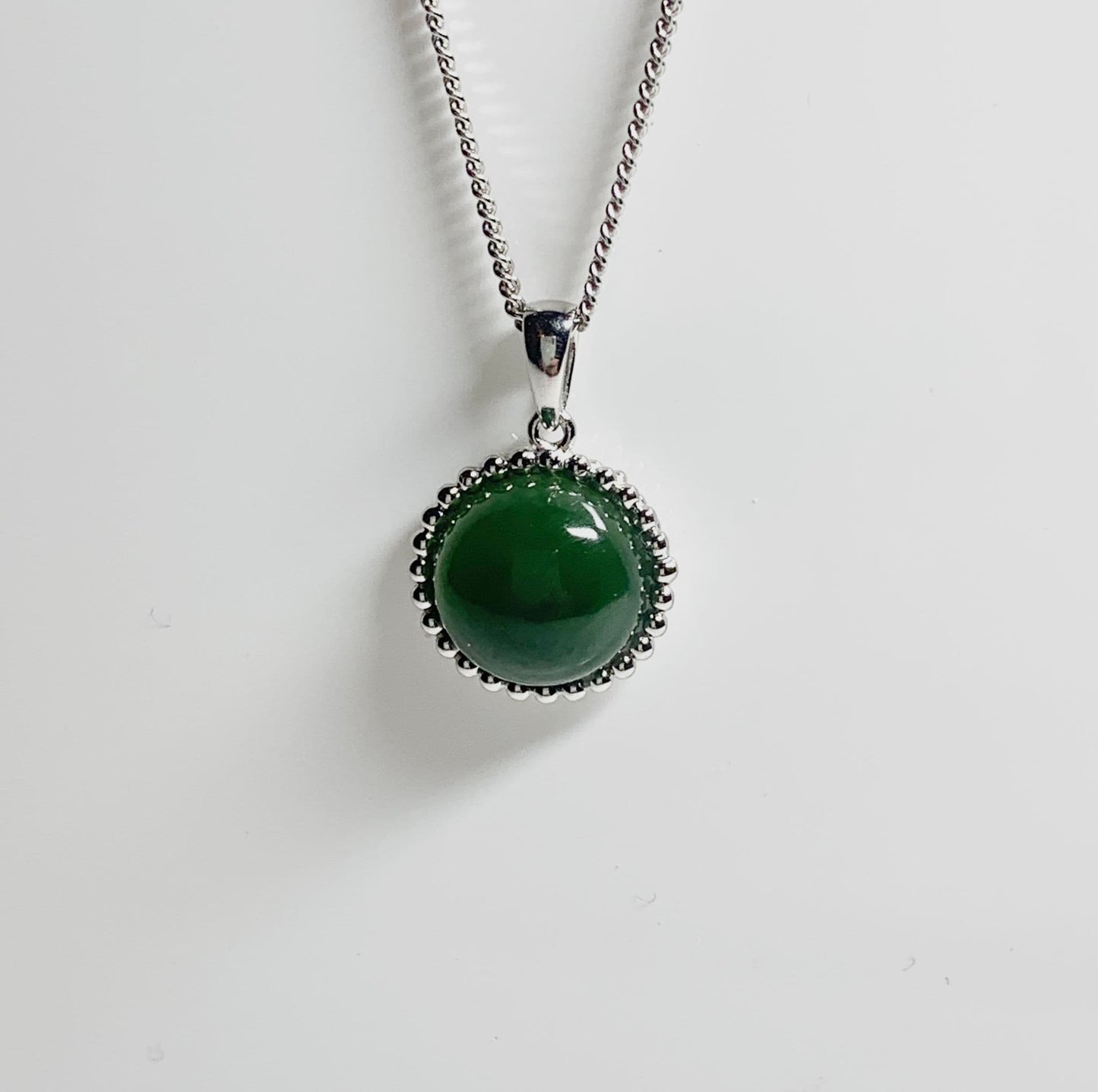 Round green jade patterned bobbled necklace sterling silver pendant