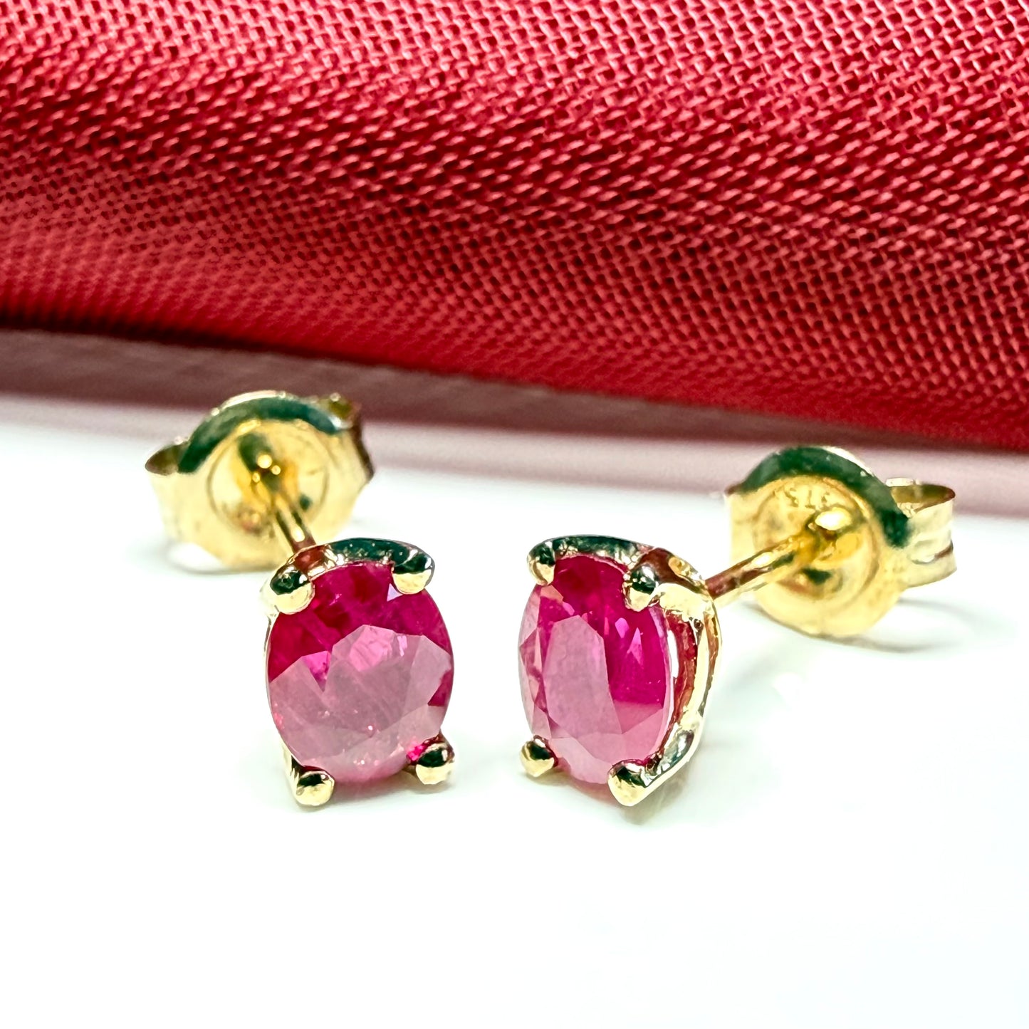 ruby oval yellow gold earrings